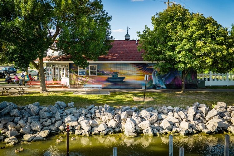 One mural is on the wall of Buoy 18, 960 E. Midland St.