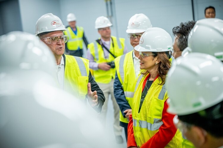 National, state, and local leaders visited the SK Siltron CSS plant in Bay County. Here, Gov. Gretchen Whitmer listens as Edward Sanchez explains what happens at the plant. (Photo courtesy of SK Siltron CSS)