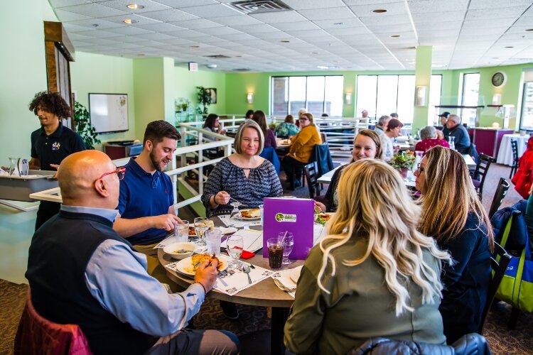 The Blooming Chefs restaurant has its own entrance to welcome diners from throughout the community.