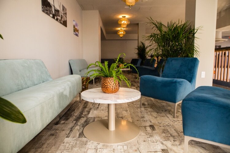 A soft seating lounge gives the mezzanine level a non-traditional feeling.